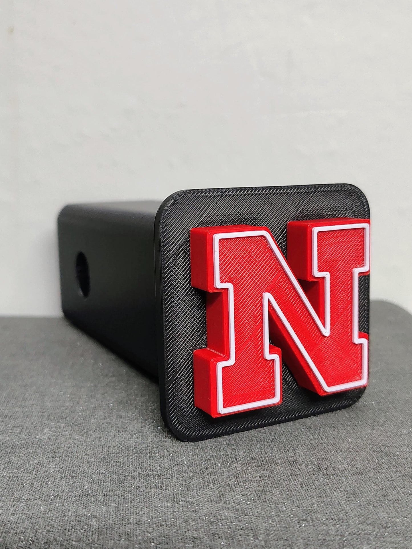Nebraska Cornhuskers Trailer Hitch Cover, ASA Plastic, Weather Proof, UV Resistant, College Football Decor